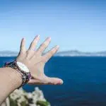 person trying to reach mountain